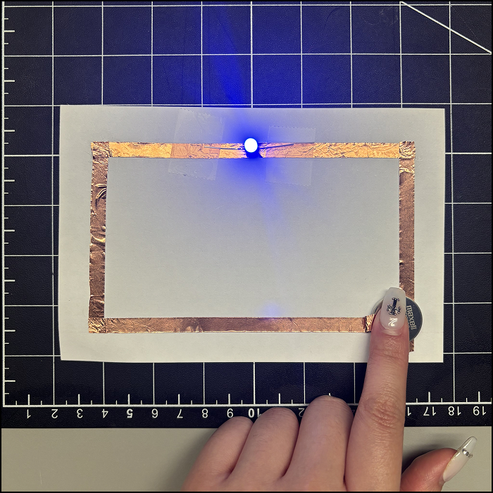 This is a picture of the simple circuit taken after I light up the LED.