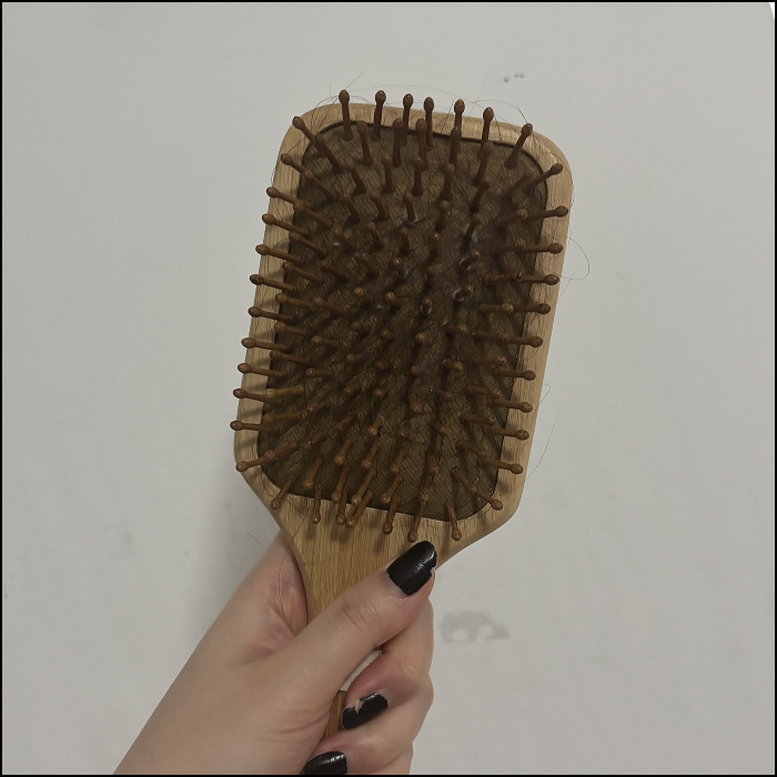 The sound of using the hairbrush to untangle my hair.